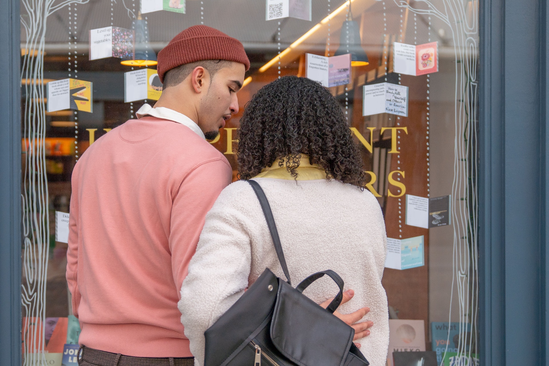couple looking into a boutique