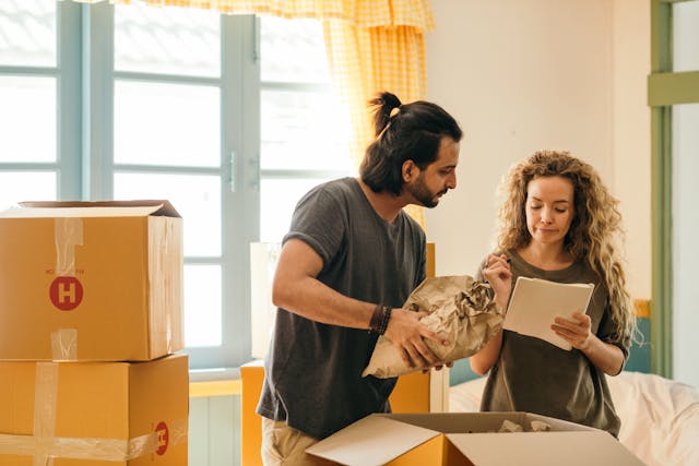 Couple packing during a move