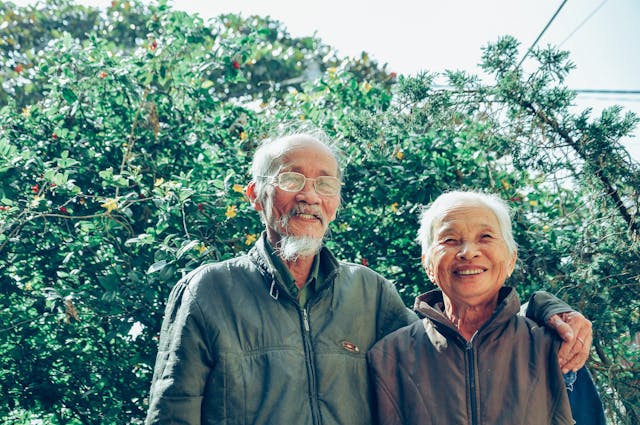 Older couple outside smiling